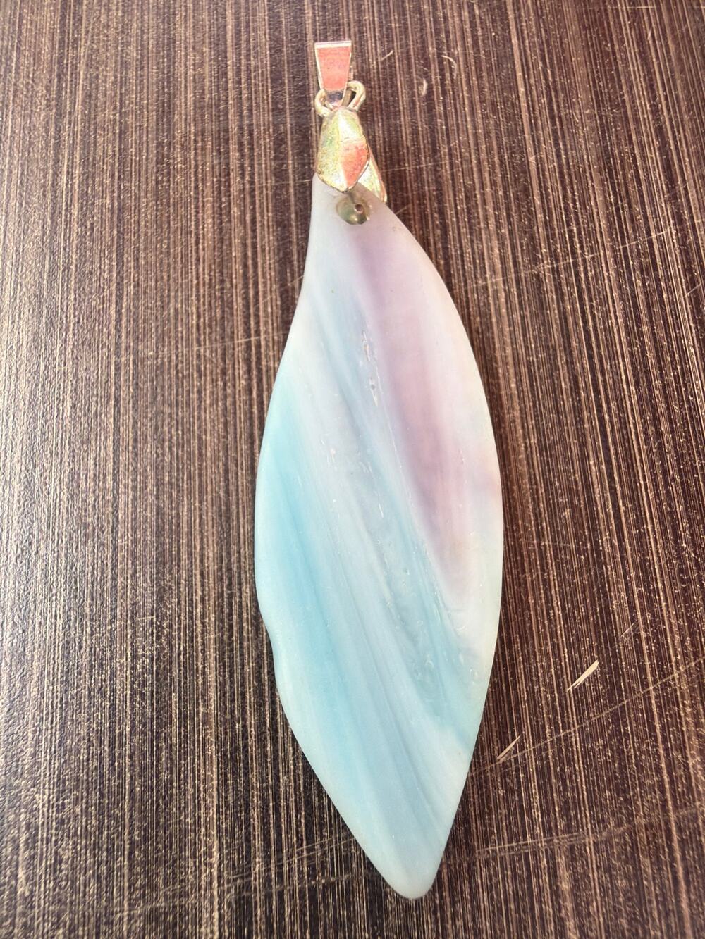 Stylized White Opalite Pendant With A Pearlescent Pear Shaped Cut